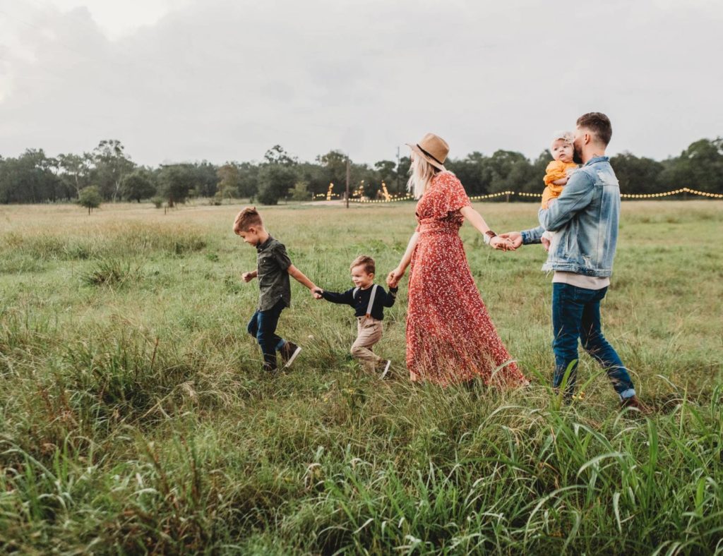 Loved ones walking through a field
